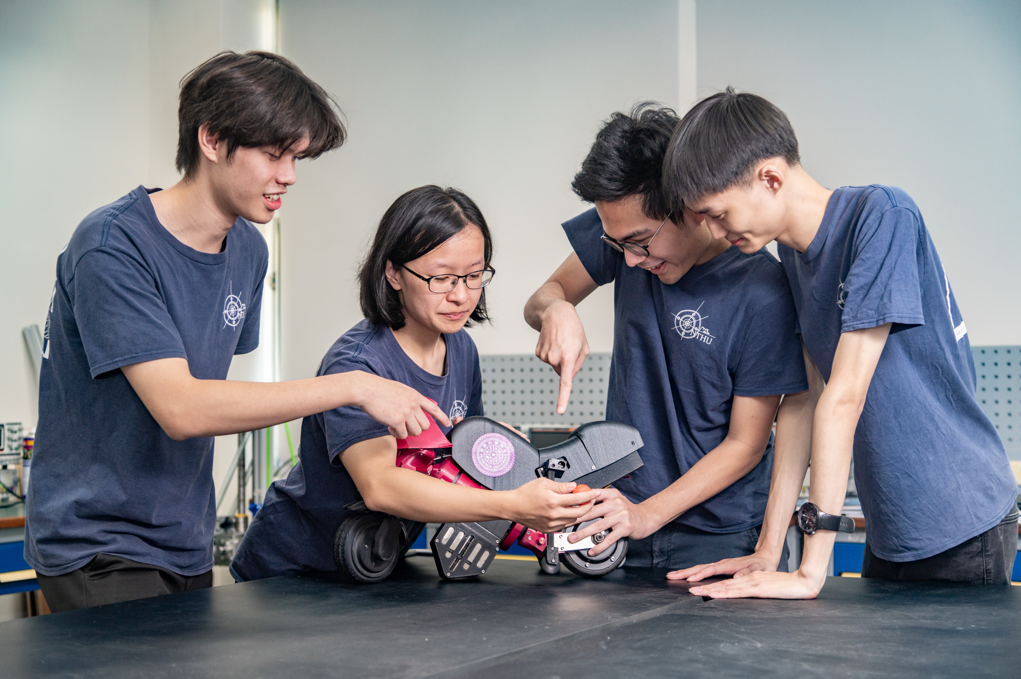 NTHU Power Mechanical Engineering students, including Chen-Yu Peng (彭震祐) (left), Yu-Fen Chen (陳昱棻), Yung Tai (戴雍), and Wei-Shan Lee (李威杉), have developed a self-balancing motorcycle prototype.